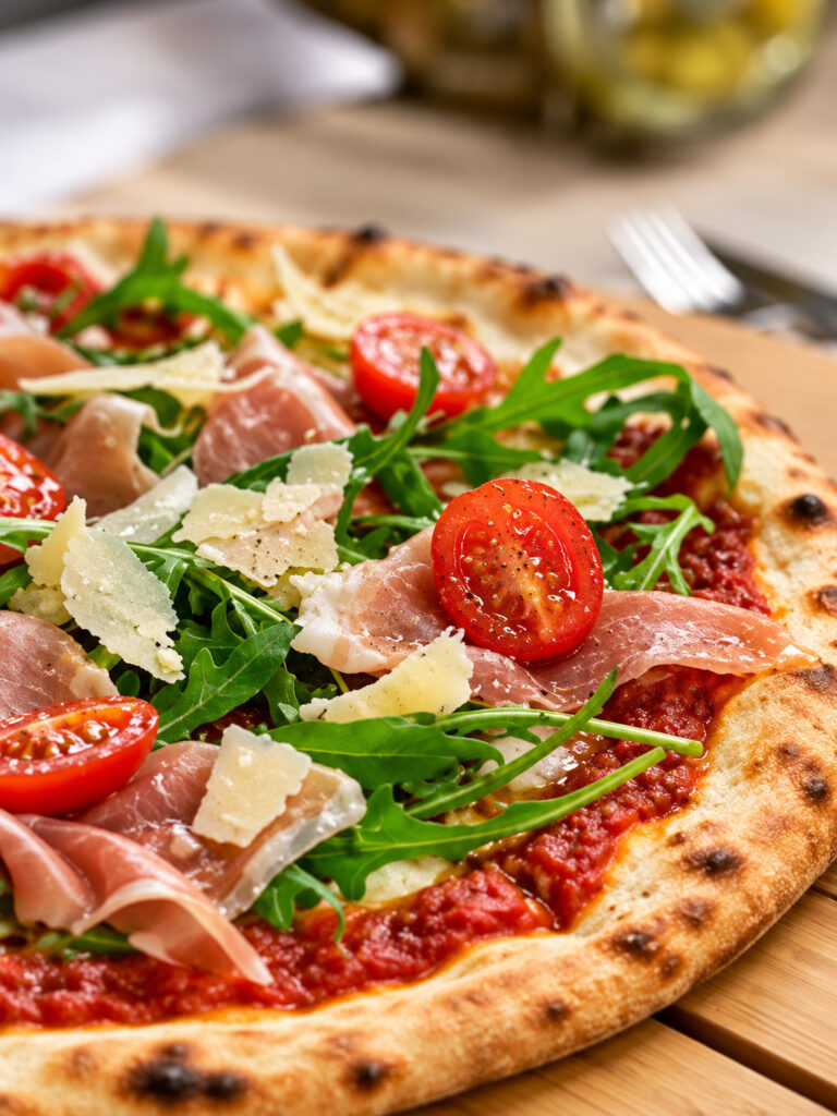 Pizza Gino's z Prosciutto Crudo, rukolą, pomidorkami i Grana Padano
